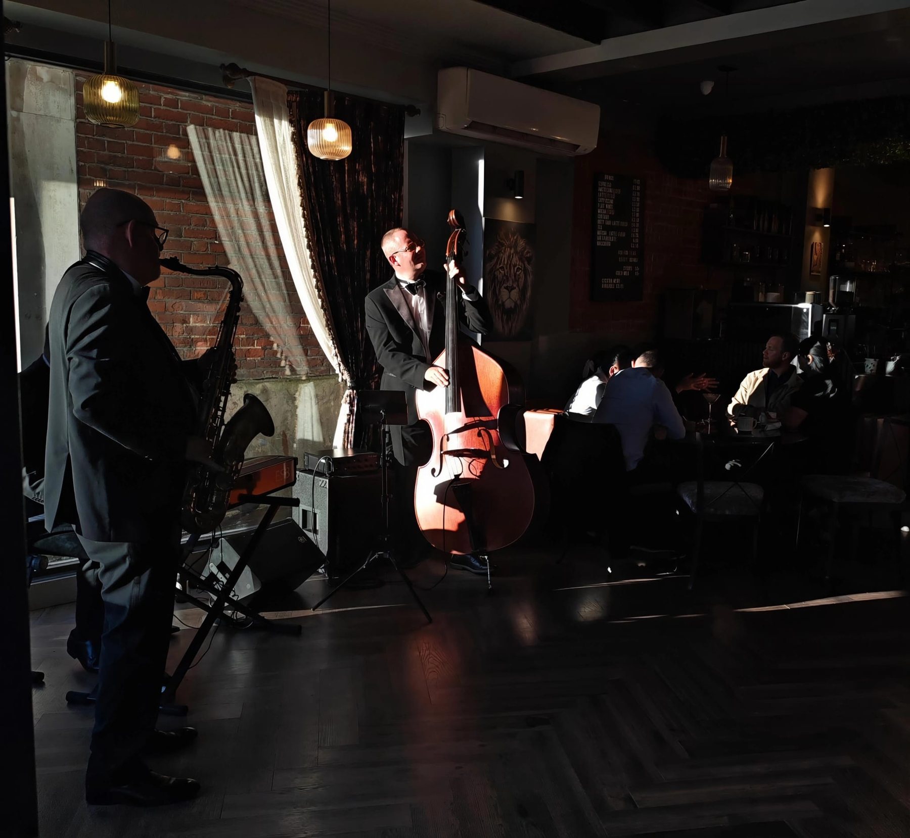 Live jazz trio performing at The Aslan Lounge