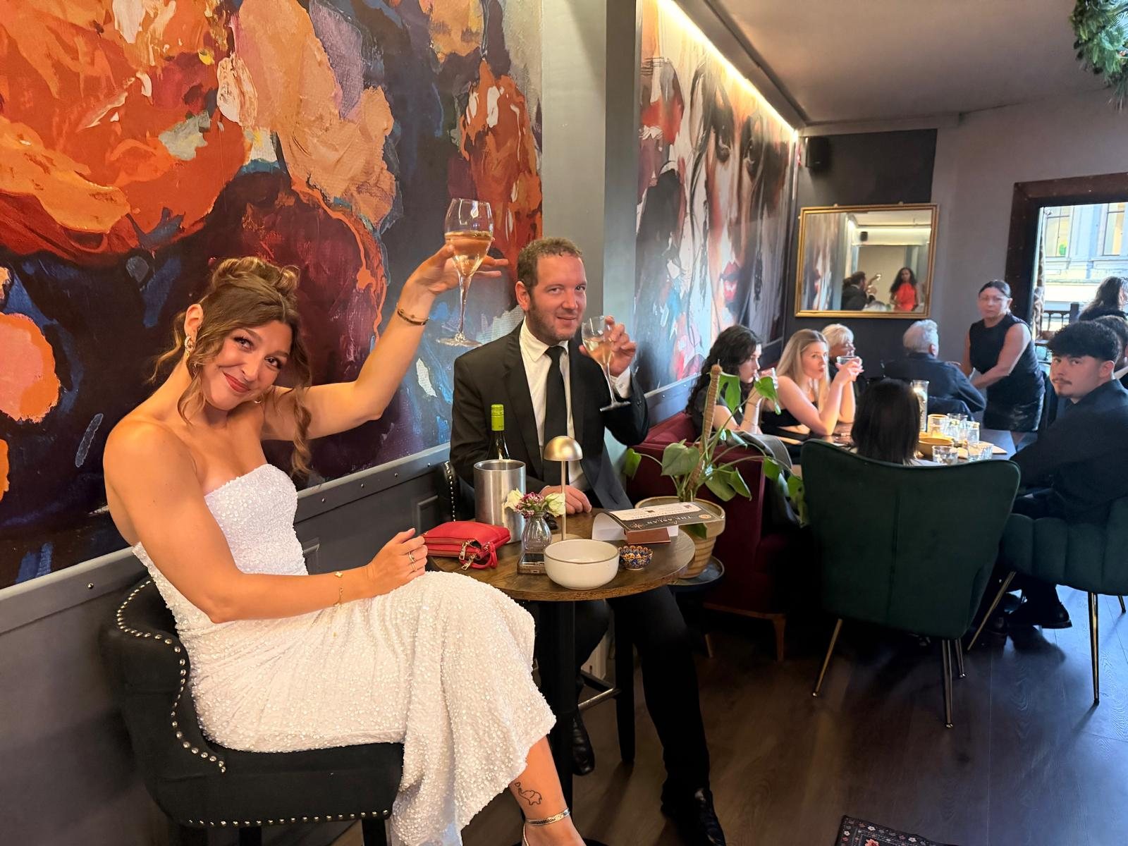 Guests toasting at The Aslan Lounge grand opening